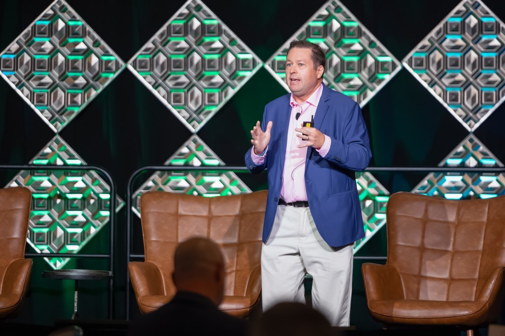 Rich Vallaster main stage speaking about AI
